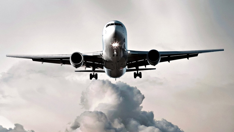 leaving, cloud - sky, air vehicle, outdoors, motion, commercial airplane, approaching, flying, landing - touching down, above, moving down, journey, low angle view