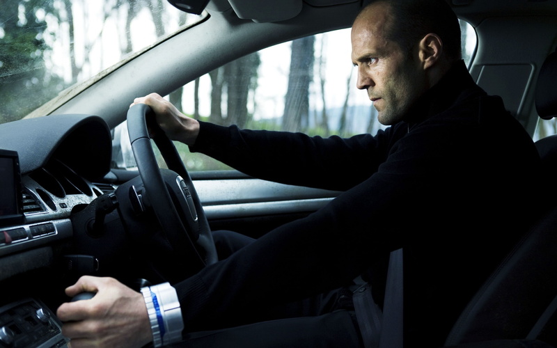 Jason Statham, holding, travel, Transporter, day, land vehicle, motor vehicle, vehicle interior, transportation, 2K, one person, indoors, real people