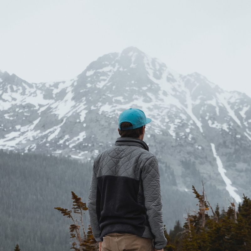 one Person, lifestyles, jeans, nature, brown, non-urban scene, plants, mountain, trees, jacket, real people, people, snow, wearing, looking, outdoors, rear view