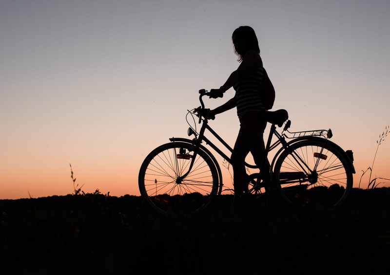 holding, full length, dusk, silhouette, outdoors, orange color, men, person, mode of transportation, romance, recreational Pursuit, mountain Biking, land