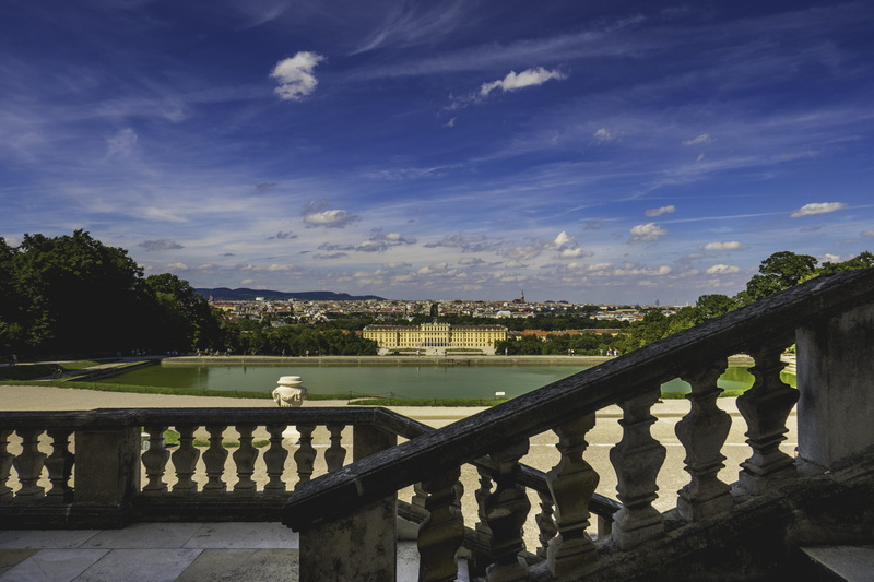 fountain, sisi, railing, built structure, terrace, nature, building exterior, city, sky, day, plant, sunlight, no people, balustrade, water, building, cloud - sky
