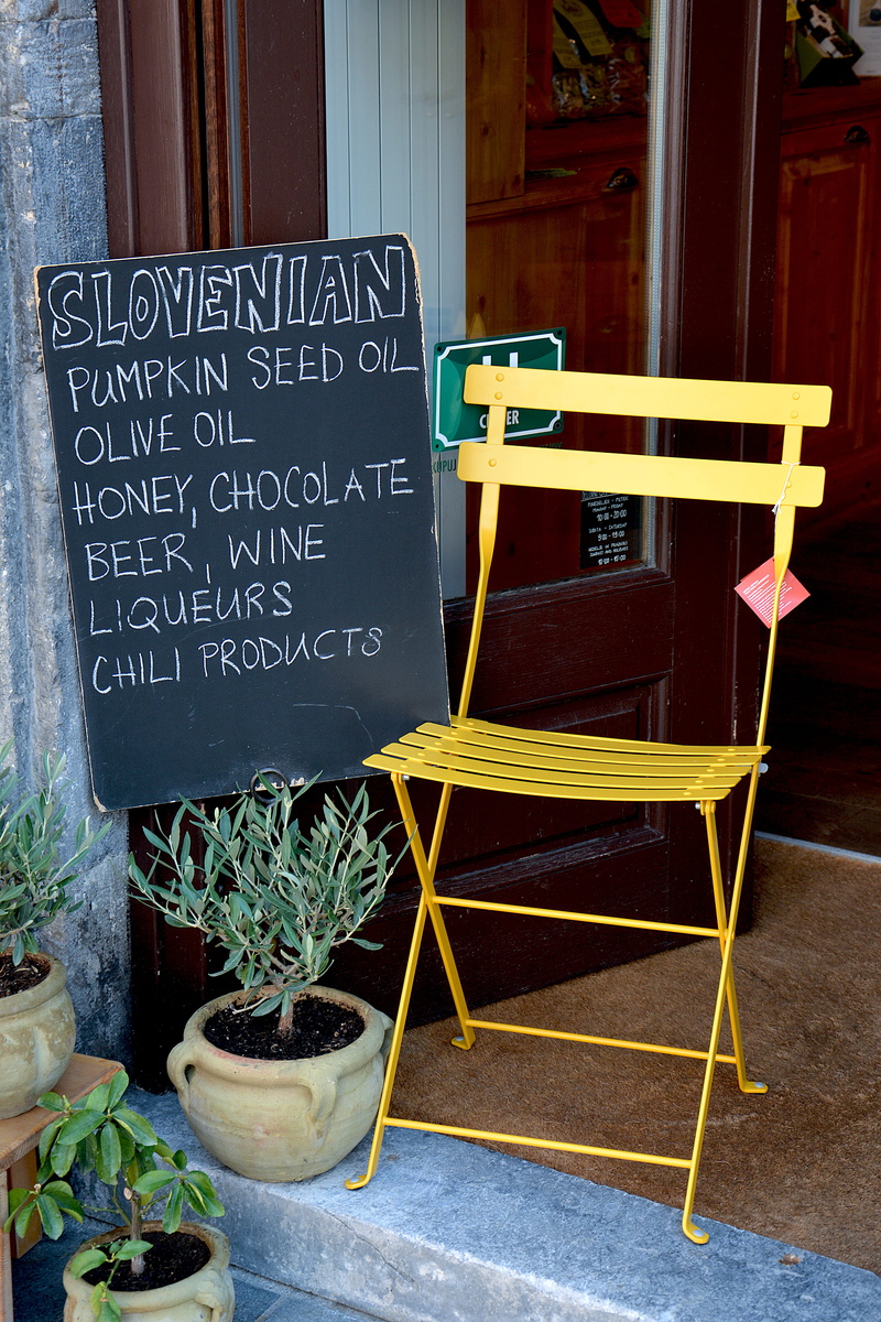 text, no people, doorstep, non-western script, sign, seat, script, slovenia, yellow, menu, 5K, wood - material, food and drink, cafe, communication, potted plant
