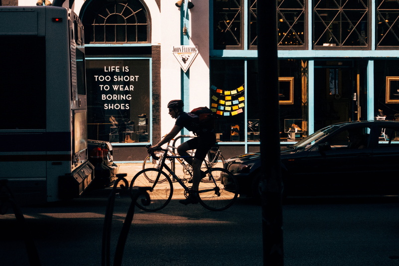 outdoors, real people, men, city life, cycling, street, architecture, bikes, built structure, city and Urban, car, riding, bicycle, motor vehicle