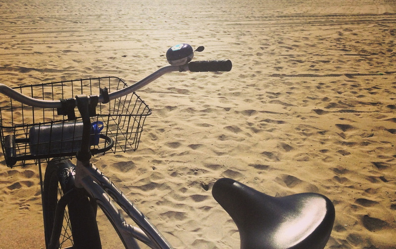 low section, stationary, day, beach, shoe, sand, body part, no people, mode of transportation, handlebar, 1080P, bicycle, land vehicle, nature, outdoors