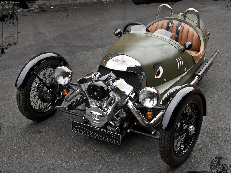 car, mode of transportation, outdoors, land vehicle, brown, motor vehicle, day, city, luxury, vintage, silver colored, transportation, no people, wheel