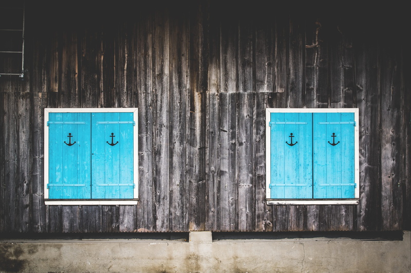 close-up, built structure, exterior, household equipment, shape, rustic, dirty, turquoise, color, door, concrete, design, hanging, day, wall - building feature