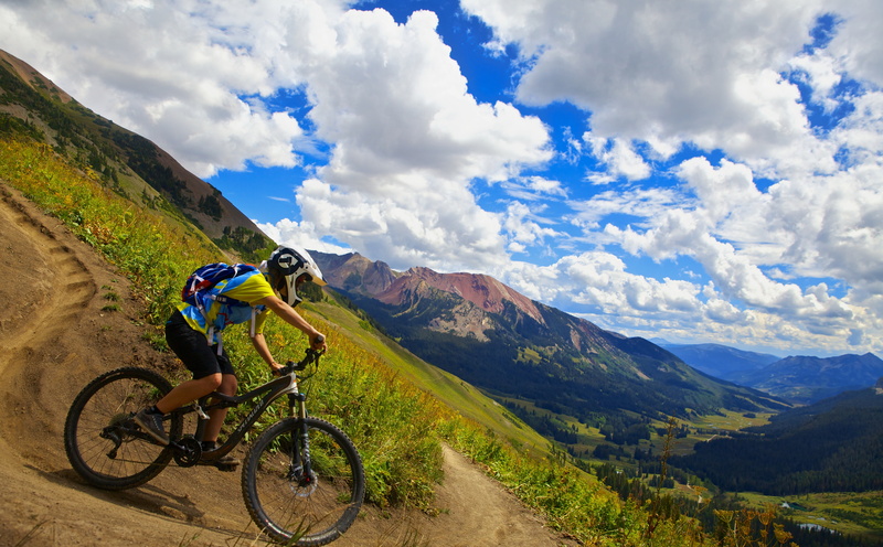 singletrack, mountain range, Epic, transportation, Butte, leisure activity, cloud - sky, Trail, Mountain, land vehicle, ride, helmet, Summer, day, green