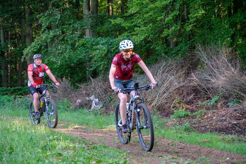 headwear, sports helmet, downhill, rtf, outdoor, adult, helmet, sports clothing, leisure activity, bicycle, two people, tree, activity, fully, landscape