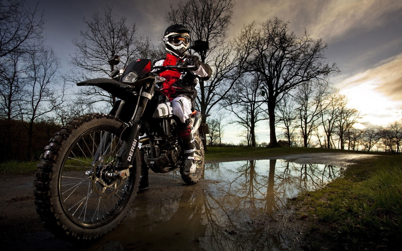 sport, red, sports helmet, headwear, bike, motorcycle, mode of transportation, riding, full length, water, helmet, bare tree, suspension, full, black, land vehicle