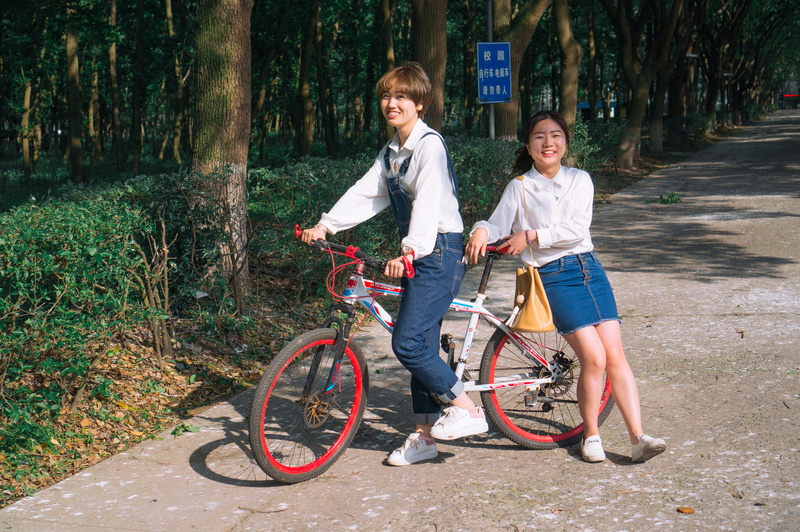 positive emotion, togetherness, university, full length, child, bicycle, looking at camera, transportation, girls, men, casual clothing, females, women