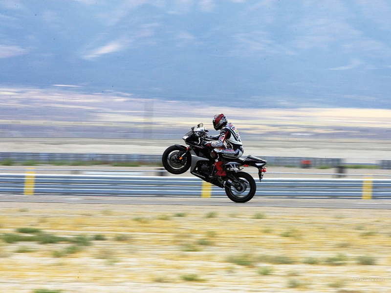 outdoors, motorcycle, Wheelie, headwear, mode of transportation, transportation, side view, men, ride, sports helmet, motion, helmet, skill, Honda, riding