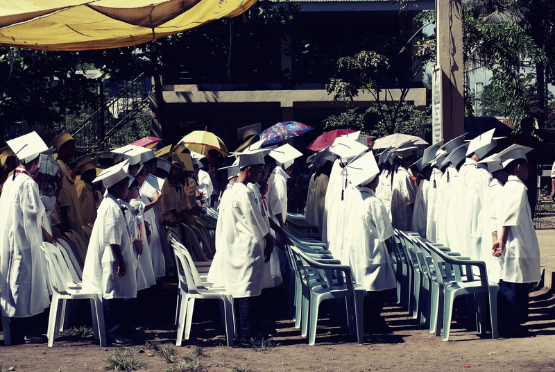 large group of people, city, graduation, nature, ceremony, children, school, protection, wearing, building exterior, lifestyles, people, umbrellas, 4K