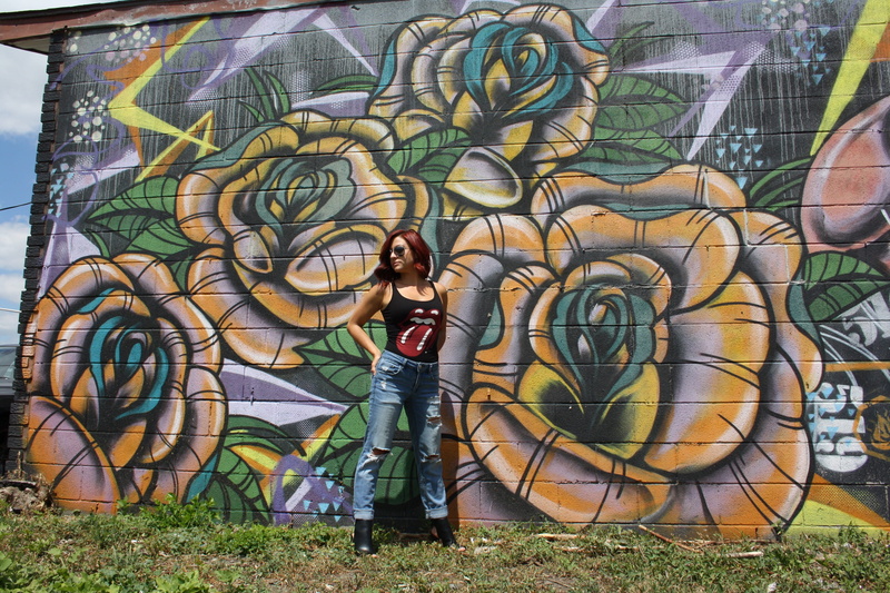real people, badass, creativity, casual clothing, standing, street art, day, wallart, full length, fashion, young women, flower art, rollingstones tee