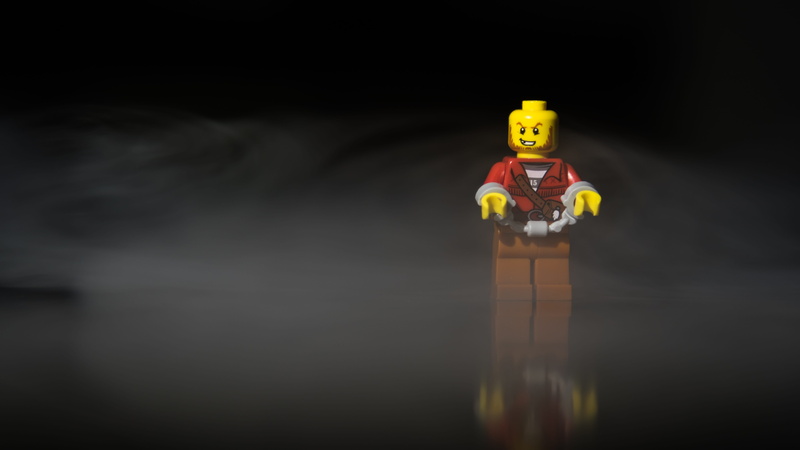 male likeness, reflection, 5K, indoors, manacle, waterfront, black background, safety, creativity, evasion, selective focus, bandit, staging, figurine
