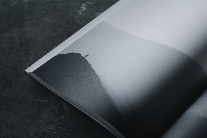 open, magazine, cereal magazine, blank, table, grey, single object, day, focus on foreground, black color, monochrome, publication, minimal, black, high angle view