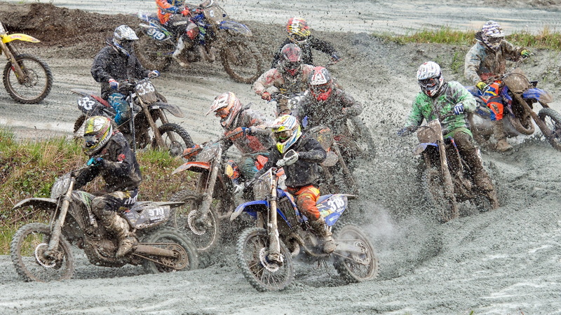competition, group of people, real people, road, dirt, sports helmet, crowd, transportation, sports race, vehicle, outdoors, headwear, day, large group of people