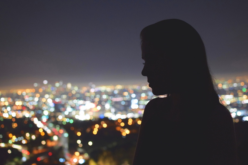 city of Los Angeles, one woman only, portrait, night, focus on foreground, angeles, cityscape, looking, at night, leisure activity, illuminated, city Life