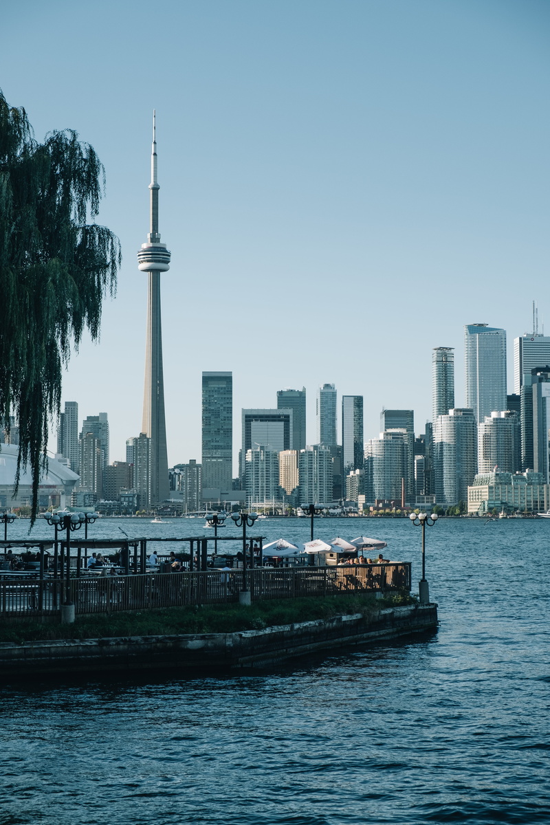 toronto islands, metropolis, city, building exterior, travel destinations, watercraft, modern, vehicle, skyscraper, urban skyline, water, high rise, cn