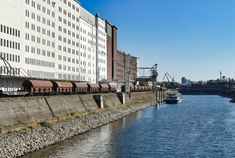 goods, transport, architecture, pool, building, rhine, no people, sunlight, city, cargo, outdoors, built structure, building exterior, port, ship, envelope