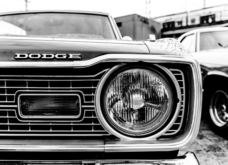 motor vehicle, land vehicle, lifestyle, metal, glass - material, close-up, luxury, stationary, car, urban, dodge, day, mode of transportation, architecture