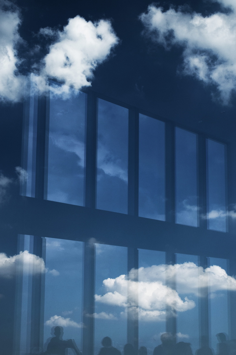 office building exterior, reflection, sky, low angle view, glass - material, built structure, transparent, outdoors, new york, cloudy, silhouette, day