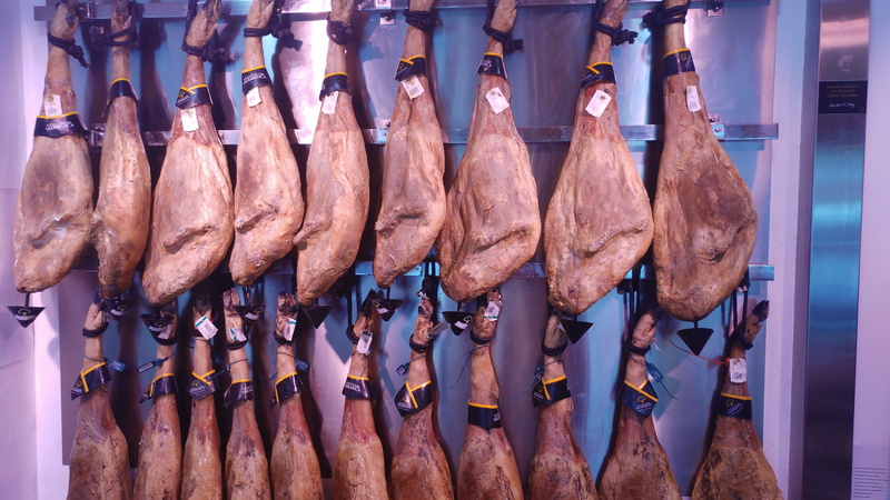 spanish food, food and drink, large group of objects, market, freshness, still life, meat, indoors, processed meat, jamon iberico, no people, repetition