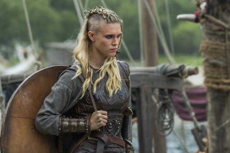 sleeved, Gaia Weiss, Porunn, nature, armed Forces, casual clothing, blond hair, black, weapon, outdoors, caucasian Ethnicity, focus on foreground, strength