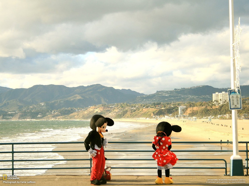 people, water, full length, lifestyles, beauty in nature, women, leisure activity, casual clothing, Mickey Mouse, beach, scenics - nature, red, outdoors