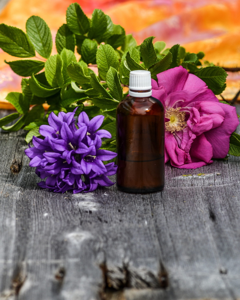 fragility, brown, scent, pink, aromatic, vulnerability, oil, body, wood - material, beauty in nature, liquid, wellness, leaves, flower head, zen, fragrance