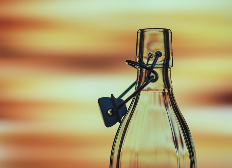 single object, empty, selective focus, thirst, design, table, focus, drink, creativity, glass, clear, wall - building feature, bright, swing, wood - material