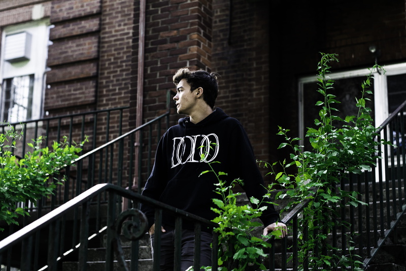 one Man Only, looking away, building exterior, man, looking, men, building, city Life, brick, day, contemplation, urban Scene, staircase, young men, holding