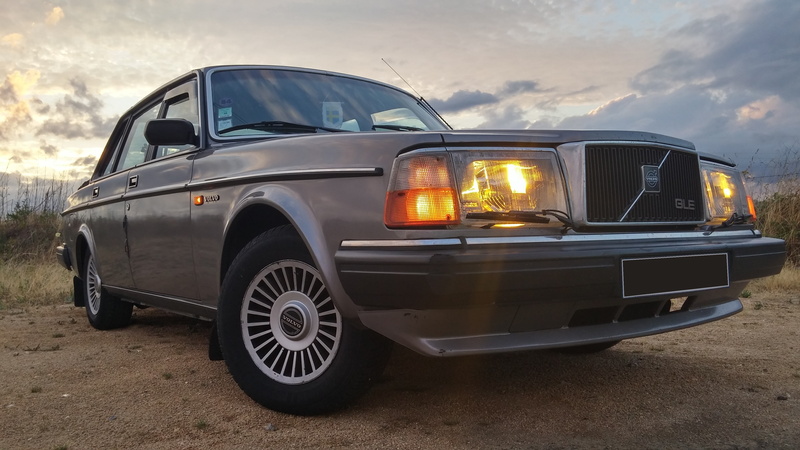 mode of transportation, land vehicle, land, retro styled, city, headlight, no people, sky, day, nature, lighting equipment, Volvo 240, cloud - sky, stationary