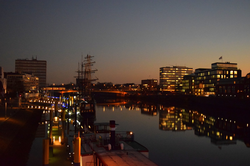 building exterior, river, cityscape, sunset, building, outdoors, sky, bridge, kill, beluga building, built structure, reflection, weser, ships, architecture