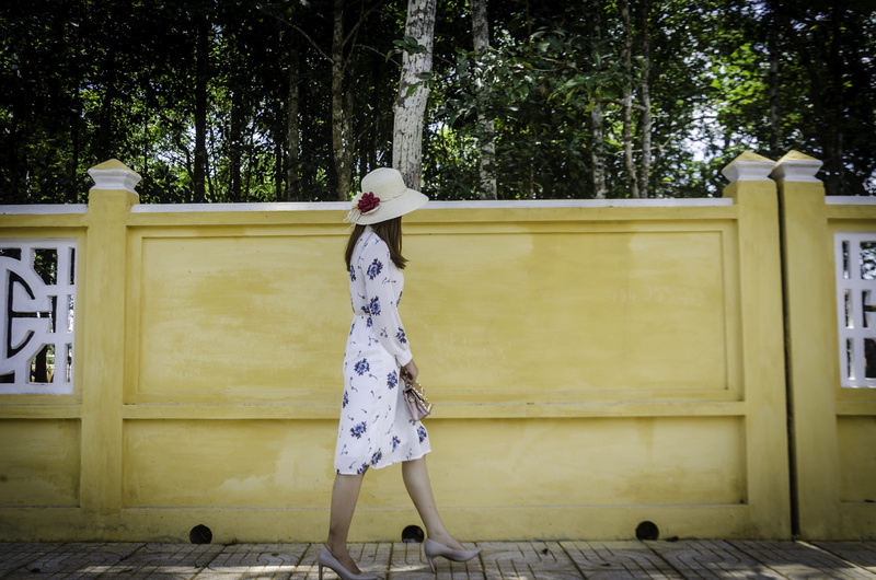 color, real people, women, ceiling tiles, lifestyles, building exterior, young, woman, hat, one person, near, outdoors, built structure, scenery, tree