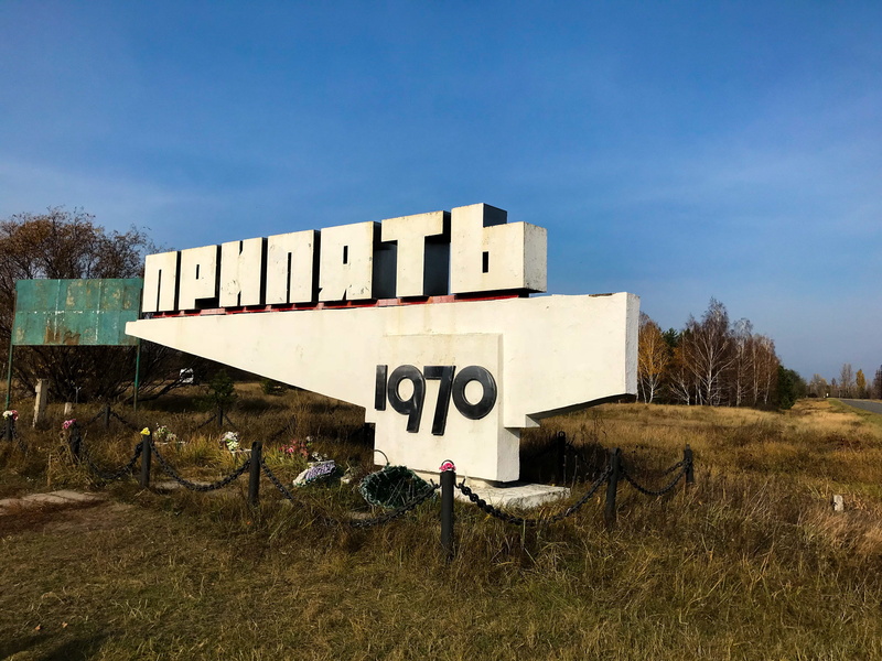 capital letter, day, outdoors, tree, pripyat, ghost town, western script, radioactive, chernobyl, field, land, information sign, built structure, text
