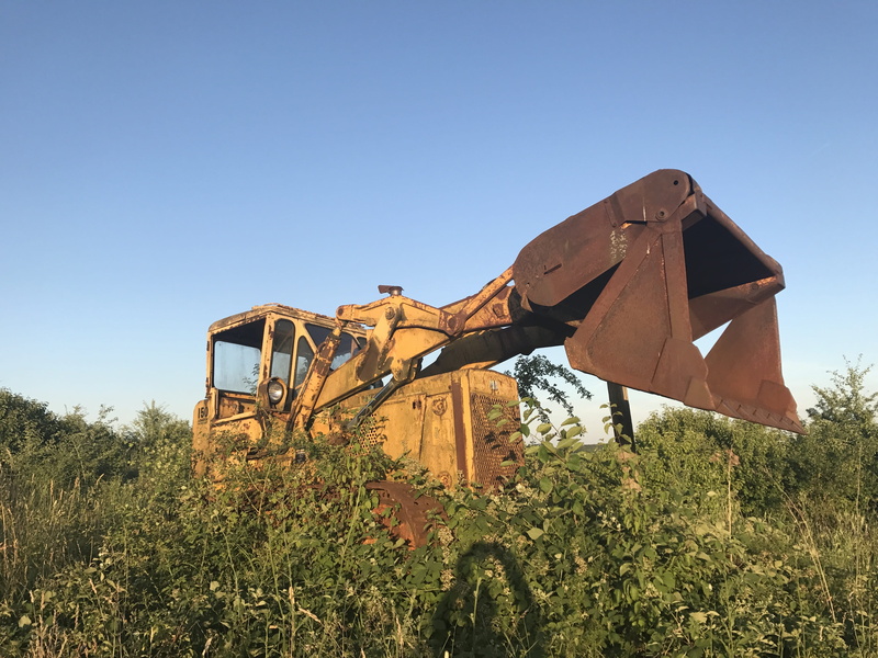 land vehicle, decay, caterpillar, turned off, bulldozer, break up, weathered, retired, clear sky, car wreck, destruction, outdoors, no people, discarded