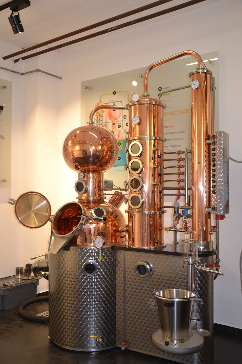 machinery, still life, technology, no people, large group of objects, wall - building feature, brandy, hanging, container, distillery, table, spirits, indoors