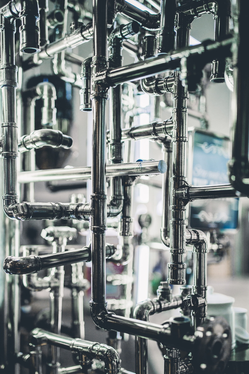 industrial machinery, selective focus, indoors, metal, pipe - tube, manufacturing equipment, silver colored, 4K, focus on foreground, business, production