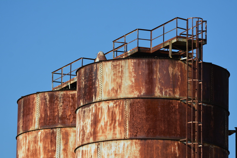 architecture, blue, industrial equipment, nature, factory, industry, clear sky, rusty, staircase, no people, fuel and power generation, oil industry, storage