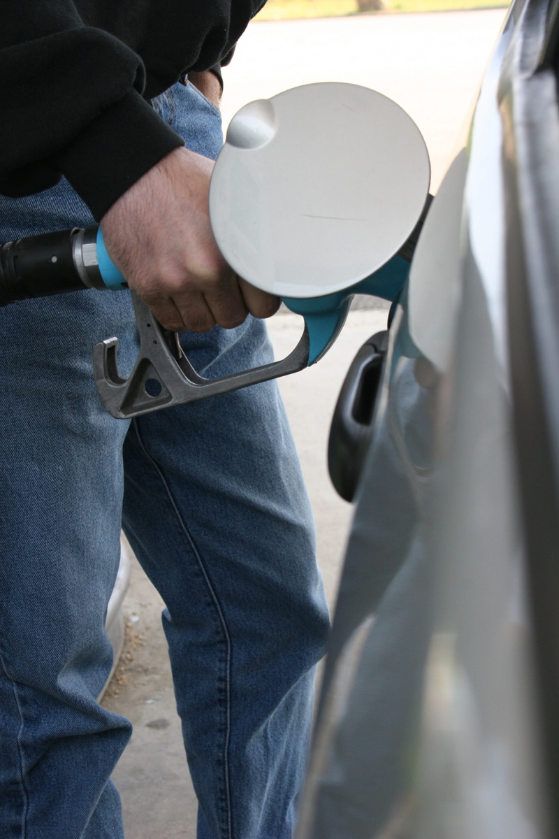 diesel fuel, denim, 2K, human body part, motor vehicle, outdoors, tank, service, lifestyles, standing, holding, real people, refinery, casual clothing