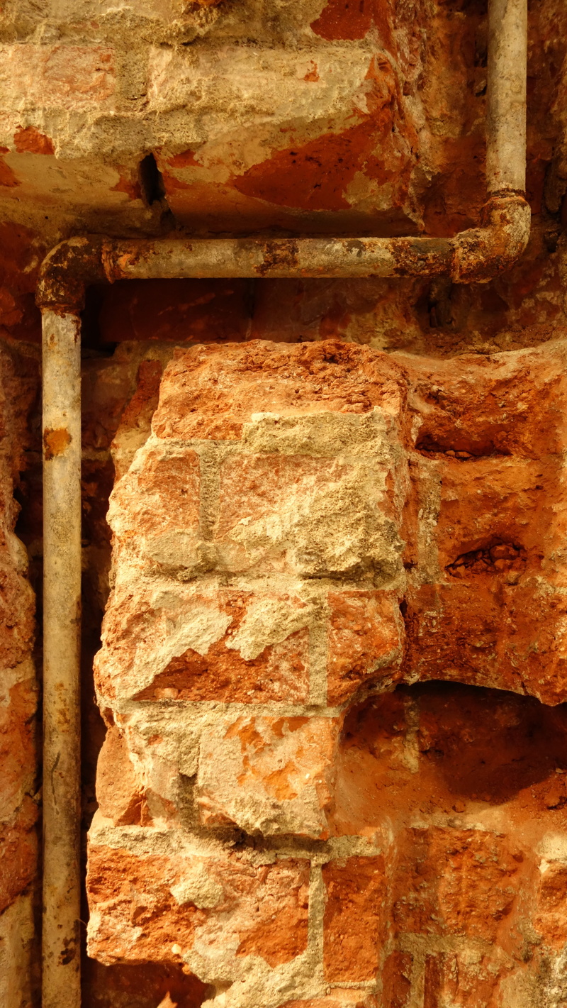 old age, no people, brick wall, stone wall, close-up, rough, gas pipe, corporation, outdoors, architecture, building exterior, backgrounds, corrosion, built structure