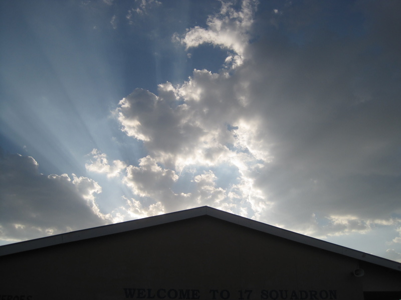 angled, light rays, angle of building, text, sun, shiny edges, outdoors, architecture, sunlight, light shafts, no people, silhouette, building exterior