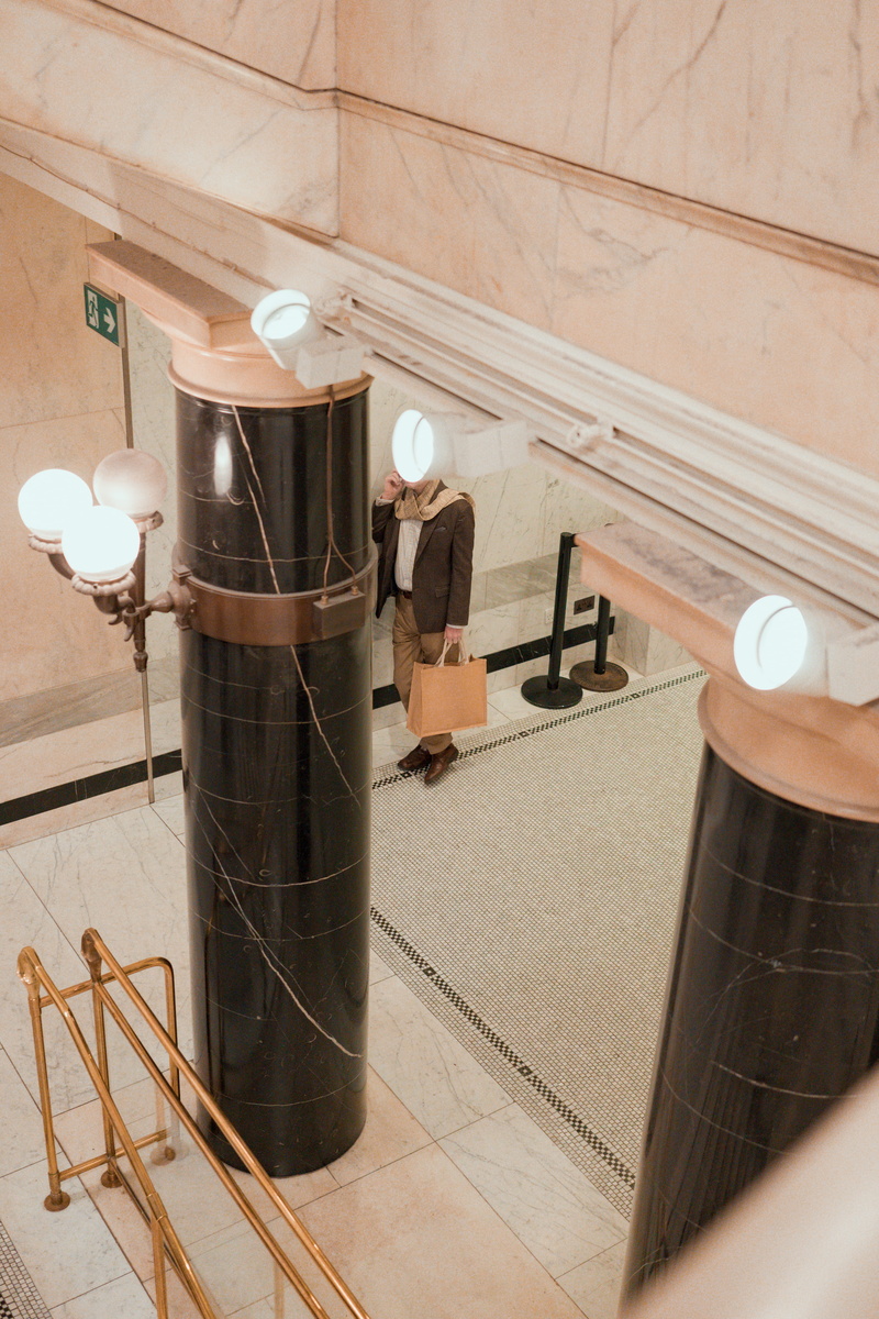lighting equipment, fashion, indoors, wood - material, clothing, person, banister, evening dress, interior design, home interior, electric lamp, lathe