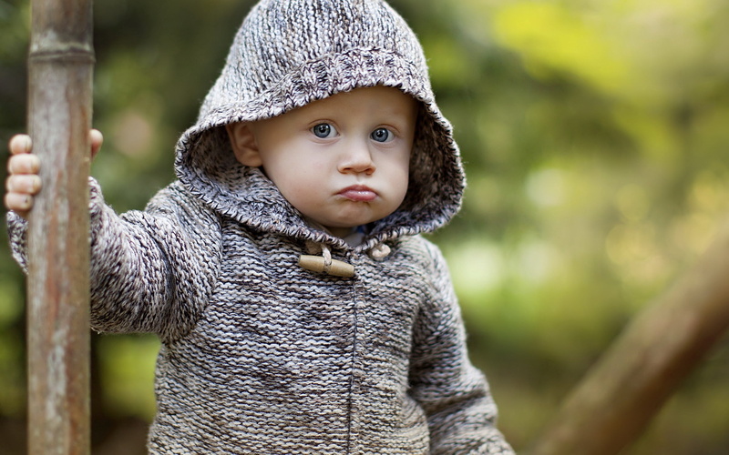 baby, outdoors, babyhood, hoodie, portrait, close-up, clothing, looking, innocence, hood, hood - clothing, toddler, front view, grimace, young, looking at camera