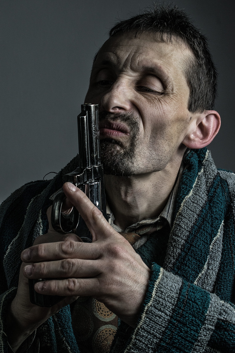 holding, men, watch, warm clothing, grotesque, studio shot, eyes closed, indoors, clothing, beard, people grimace, people, one person, young adult, pistol