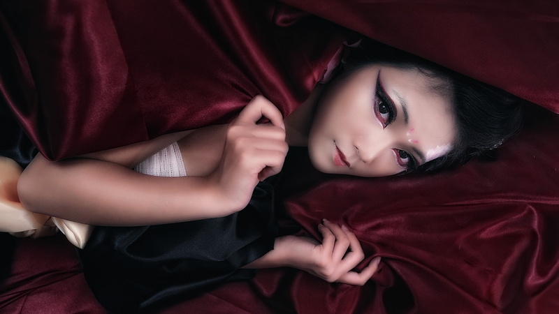 black eyes, relaxation, furniture, indoors, lying down, textile, black hair, young adult, beautiful woman, adult, one person, color correction, innocence
