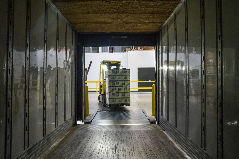 mode of transportation, occupation, door, no people, domestic room, building, vehicle, yellow, warehouse, boxes, business, equipment, transportation, architecture