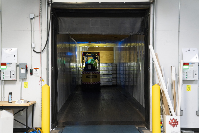 metal, warehouse, doorway, man, people, person, mode of transportation, illuminated, indoors, men, built structure, forklift, working, land vehicle, open