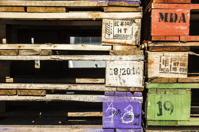 wood - material, outdoors, colorful, 2K, crate, no people, wood, script, day, text, non-western script, arrangement, box - container, large group of objects