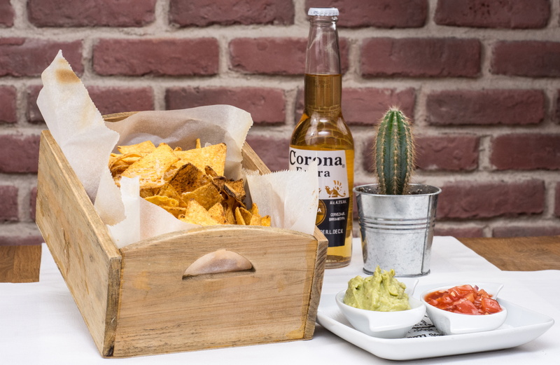 indoors, glass - material, corona beer, glass, yellow, brown, party, alcohol, food and drink, still life, lemon, no people, beside, gold, lime, food, fruit